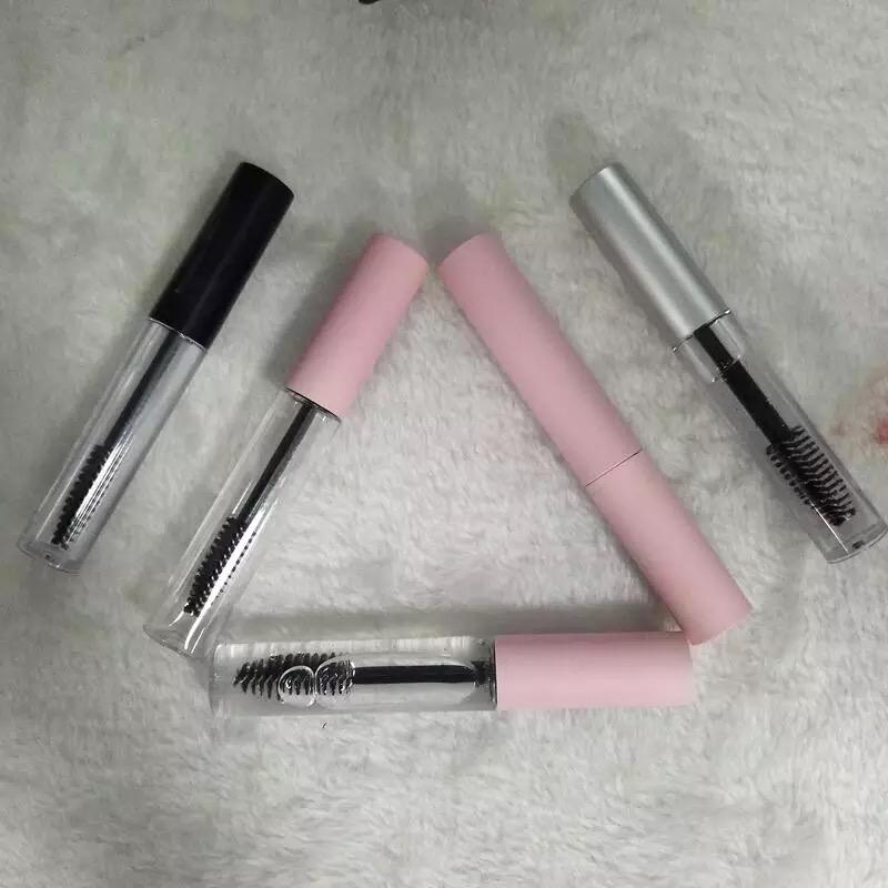 Two mascara tubes with pink and clear casings