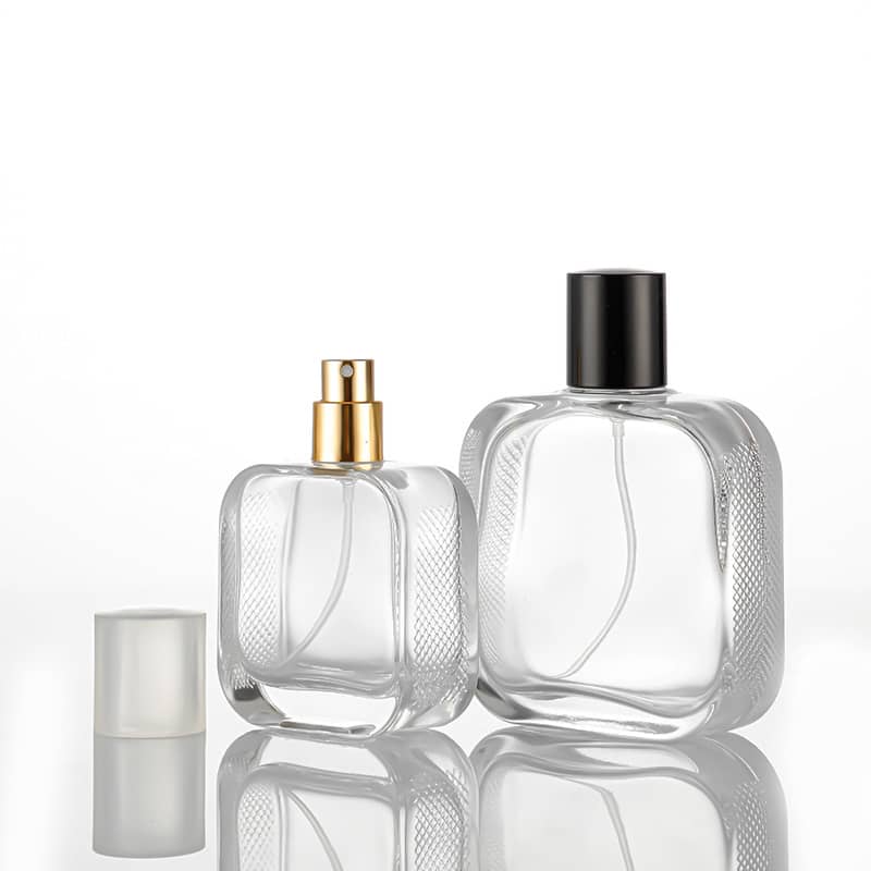 Cosource 50ml luxury glass perfume bottle set with gold and black caps on reflective surface
