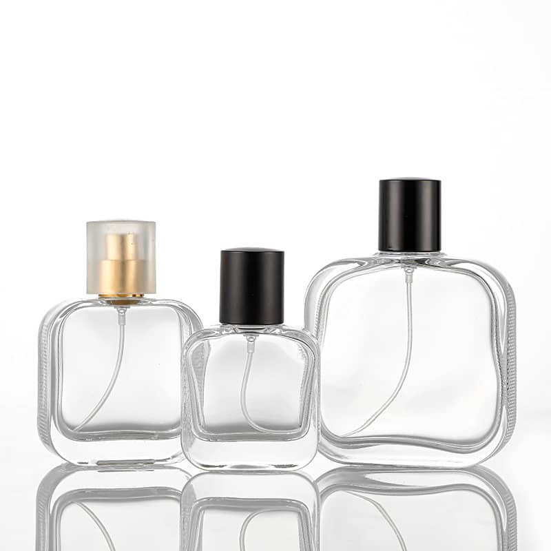 Set of three 50ml luxury glass perfume bottles with different black and gold caps by Cosource