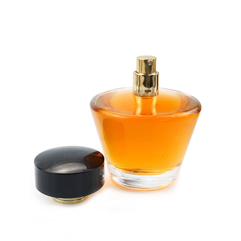 Cosource cone shaped glass perfume bottle with amber liquid and black cap removed