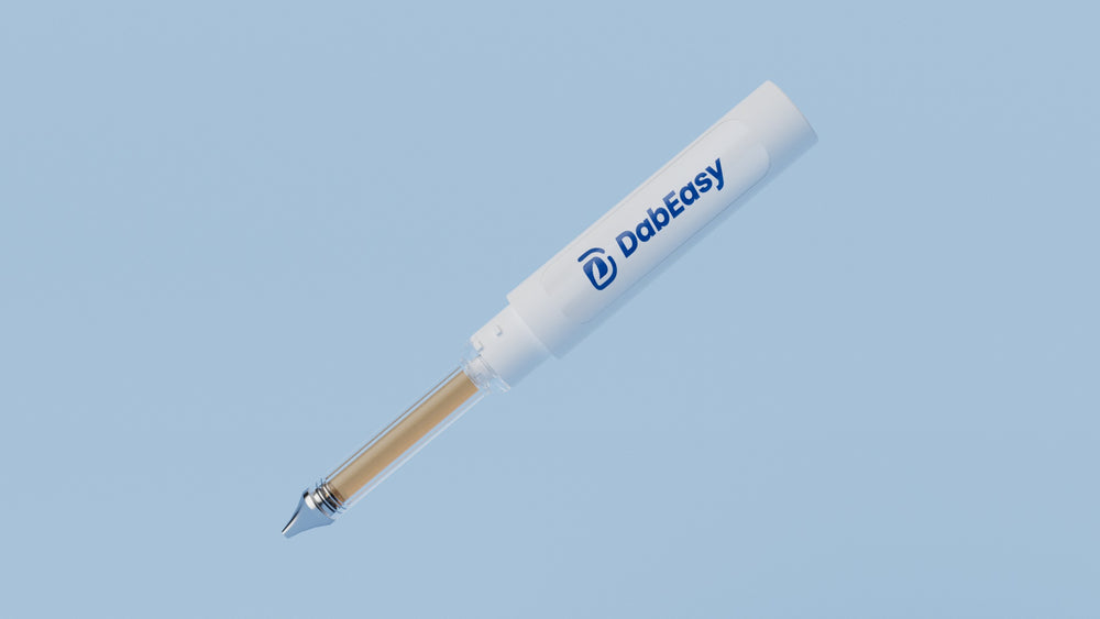 Dab Easy white dispenser rendering showing reservoir and metal dispensing tip; oil shown for illustration
