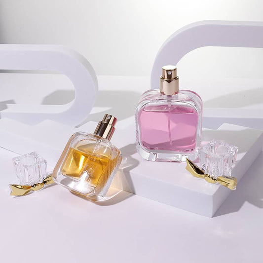 Cosource flat glass perfume bottle 50ml with gold spray cap filled with pink and amber perfume