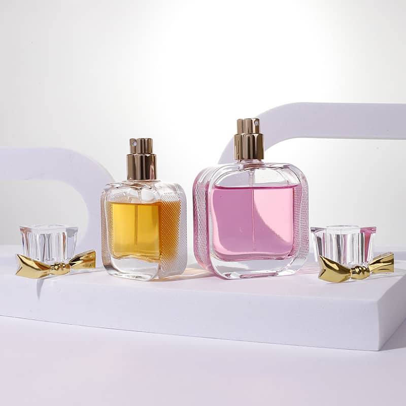 Cosource flat glass perfume bottle 50ml with pink and amber fragrance and gold bow caps