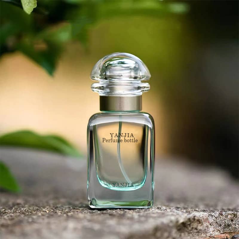 Cosource clear glass perfume bottle with a rounded cap and gradient glass perfume bottles design